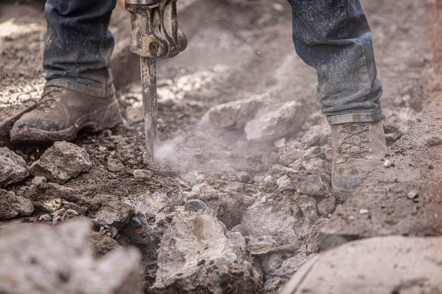 Photo of worker using jackhammer