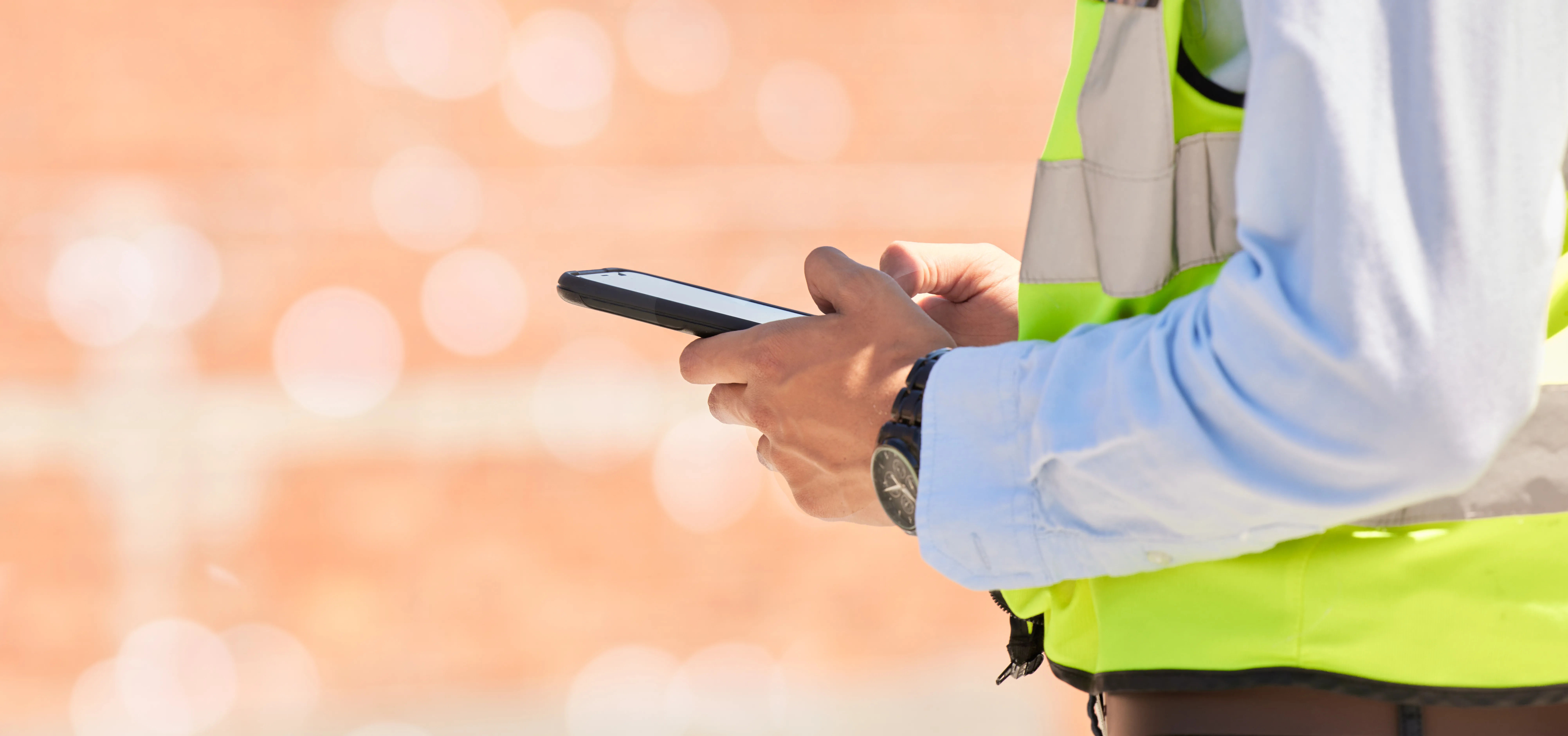 Photo of worker holding phone