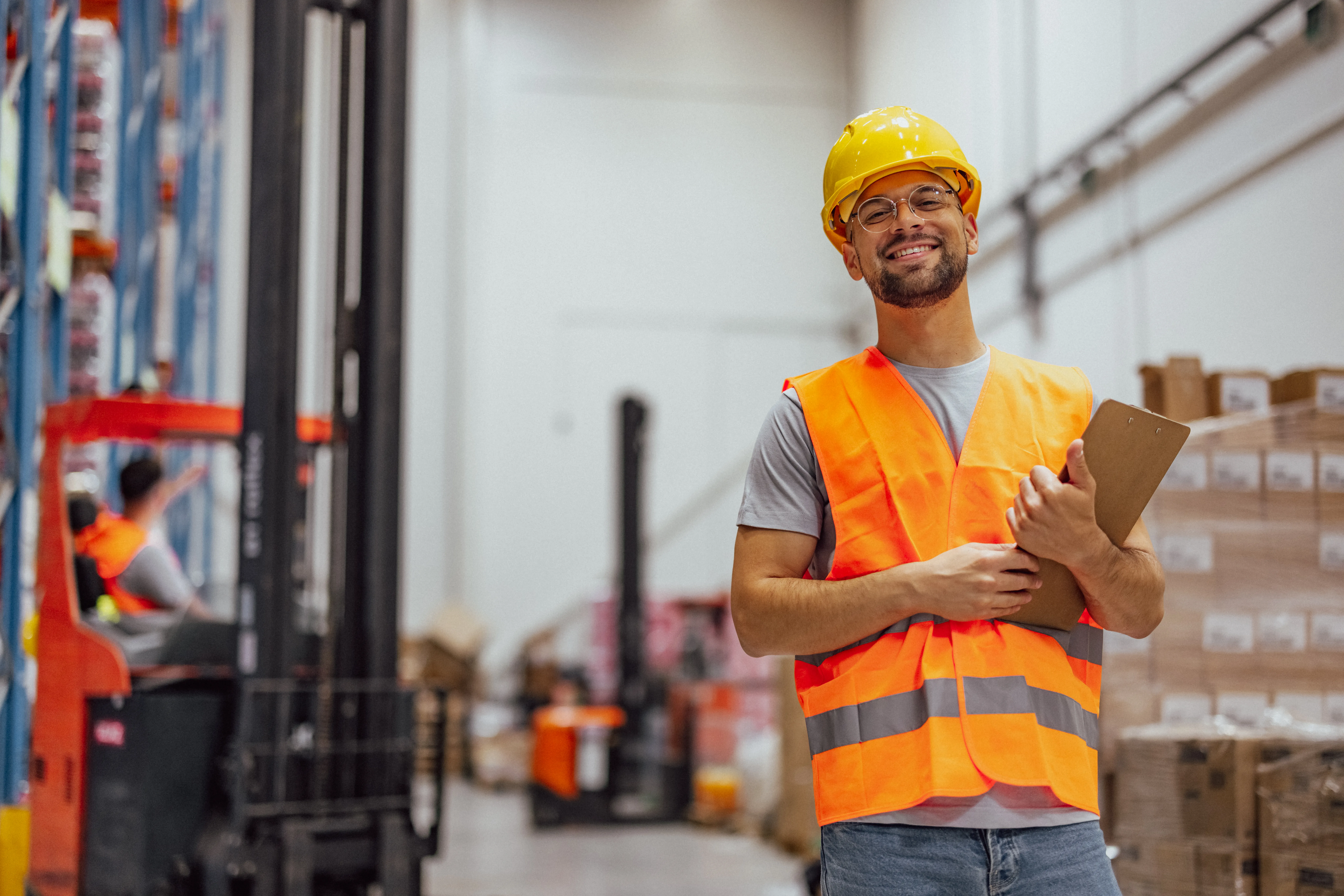 Photo of worker holding clipboard